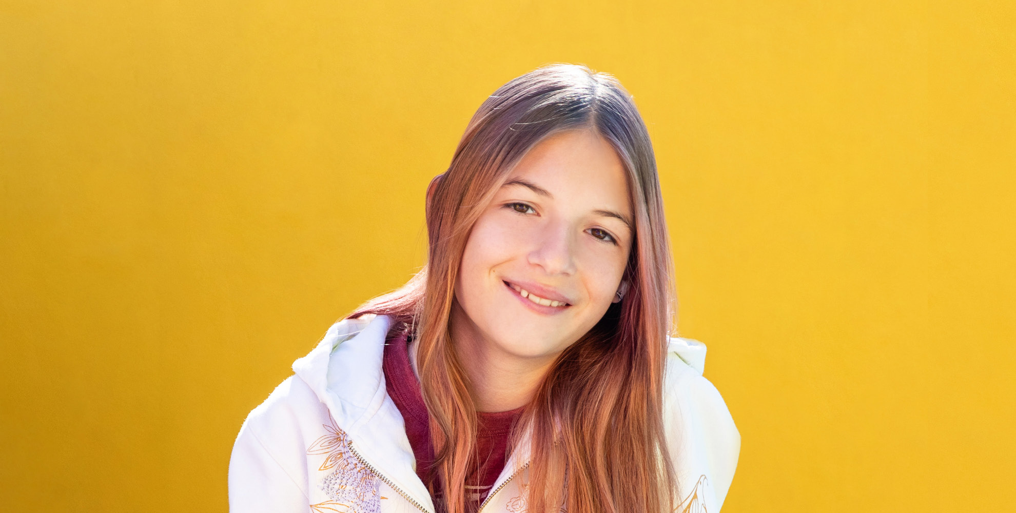 girl with white jacket and yellow background