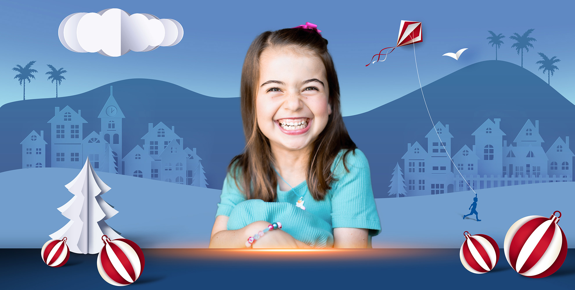 girl smiling, wearing blue shirt with blue background