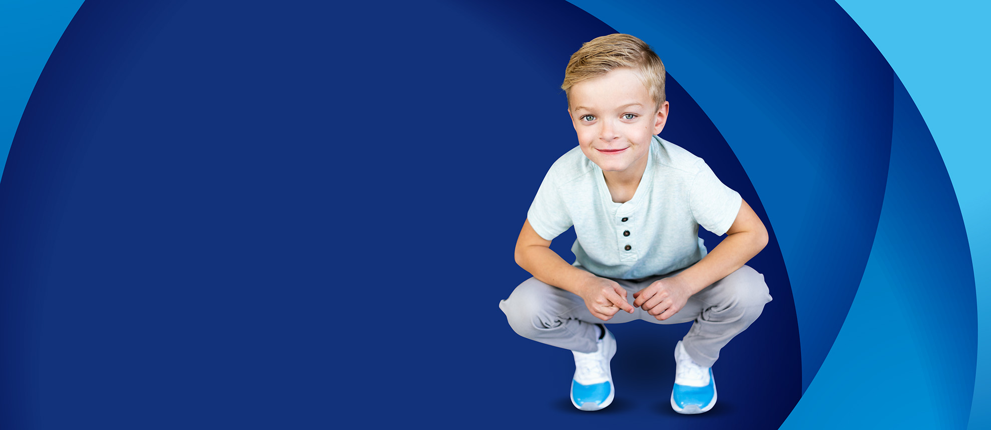 young boy with blue background