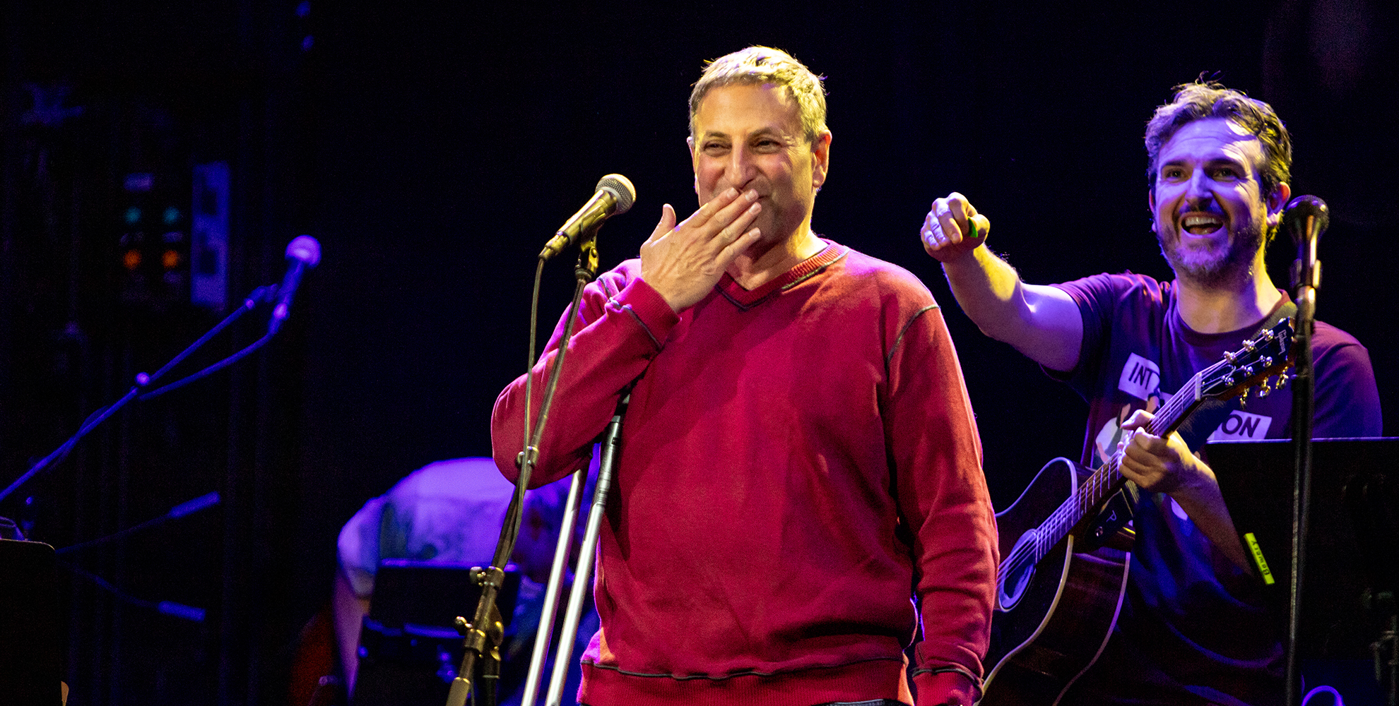 Singer with band performing