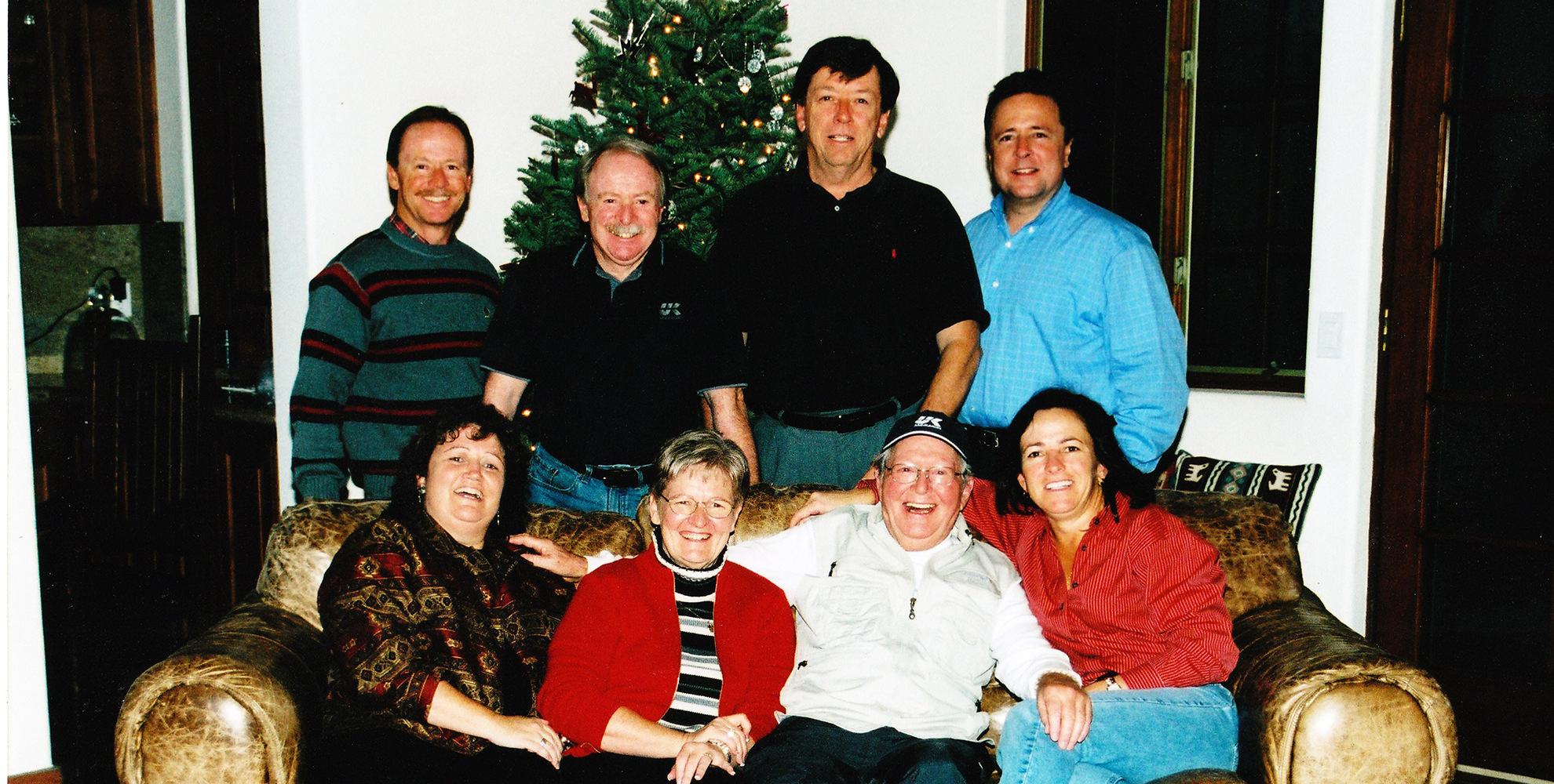 family members gathered around couch