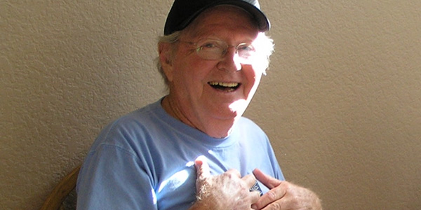 older man wearing t-shirt and glasses