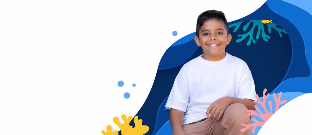 Boy wearing white shirt smiling at camera, animated ocean background