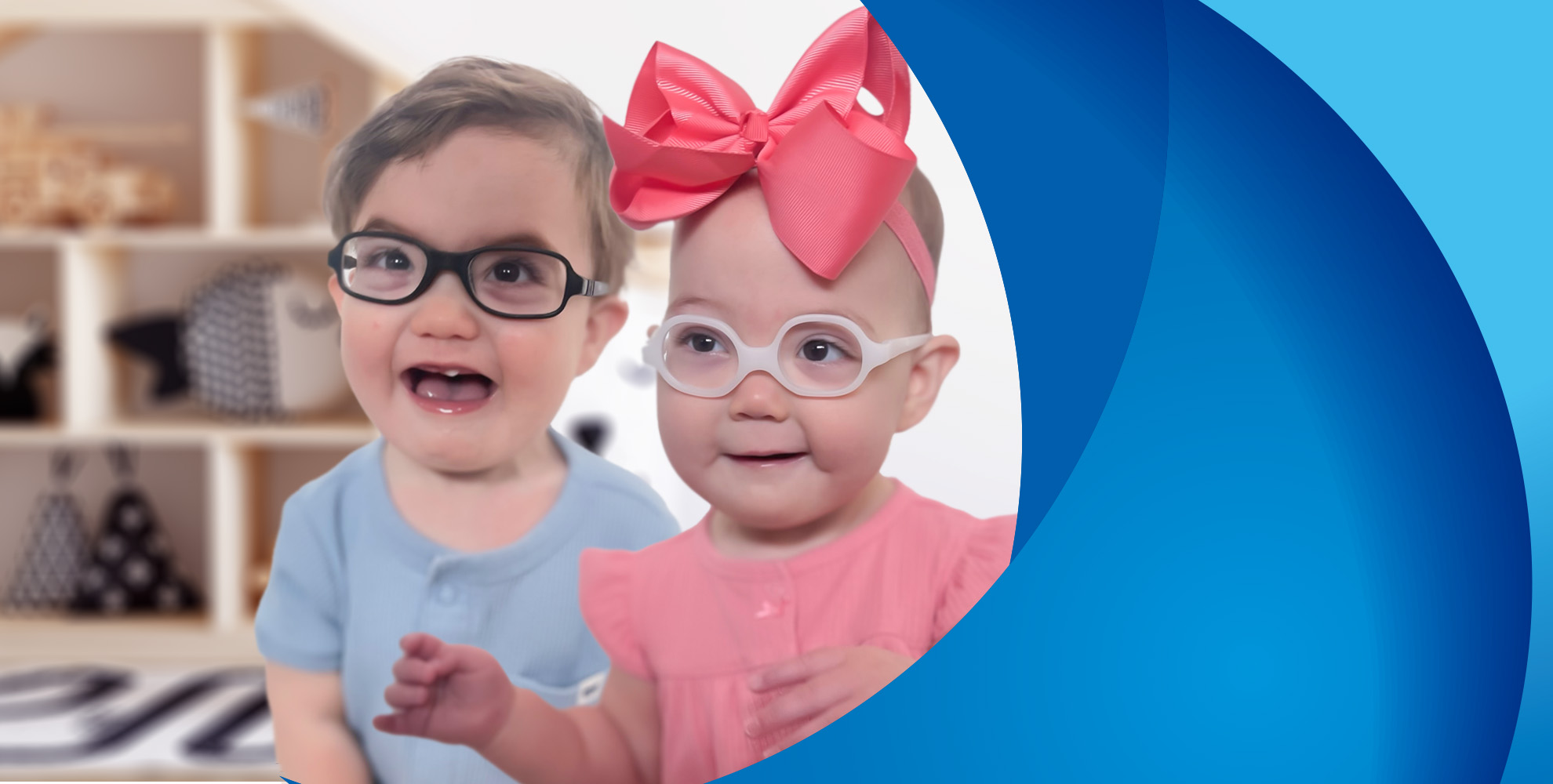 Toddler boy and girl both wearing glasses and smiling