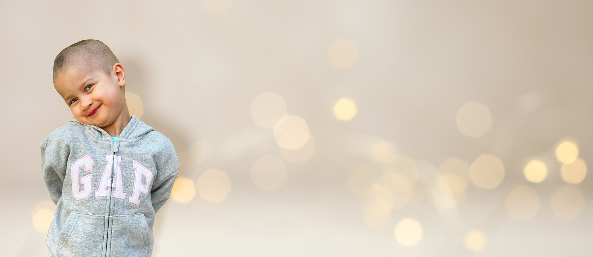 Young girl smiling with white twinkle light background