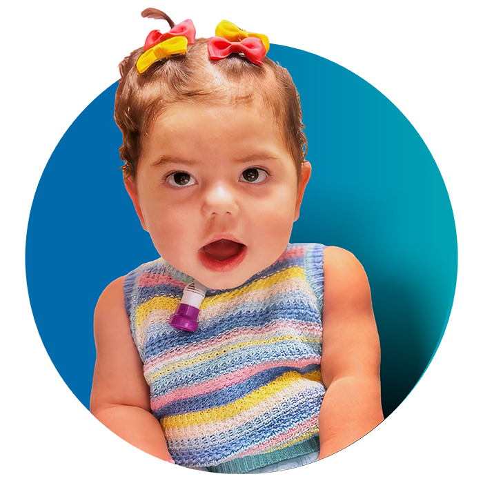 Girl toddler wearing bows in her hair with blue circular background
